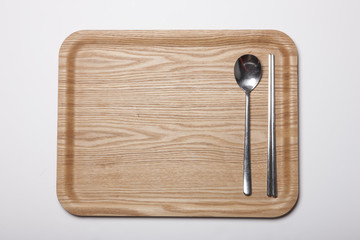 woman hand hold a wood tray isolated white.