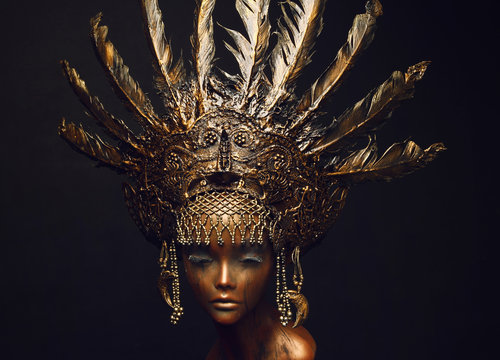 Bronze statue with head decoration
