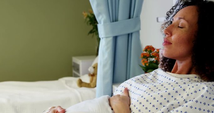 Pregnant woman relaxing in ward