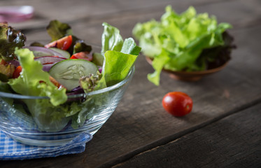 Close up of fresh vegetables salad in the bowl. Healthy food concept.