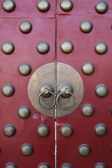 China Chinese Door Doors Red Bronze Copper Knocker Knockers Traditonal Tradition Ancient Style Old Temple Temples Monastery Monastic Maroon Asia Asian Circle Circles Culture Cultural Historic Interest