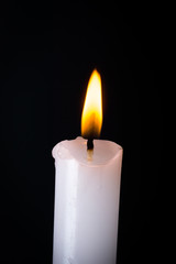 Candle on a black background