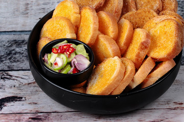 Crispy butter toast with spicy sour sauce.