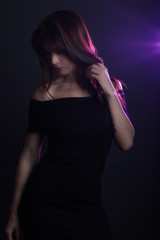 Beautiful woman wearing a black dress