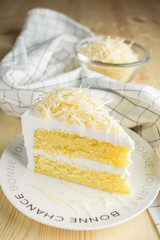 piece of cake with whip cream and grated cheese topping