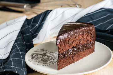 piece of homemade tasty yummy dark cocoa chocolate fudge cake ,food bakery design