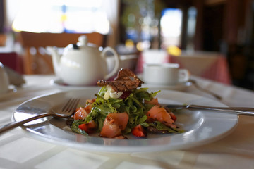 Salad in a plate on a table
