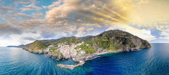 Riomaggiore in Five Lands. Aerial view from helicopter at sunset
