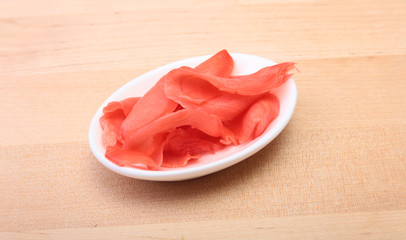 Bowl with ginger on wooden background. Japanese cuisine. Asia food.