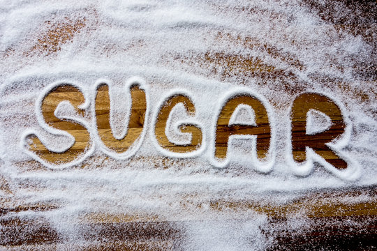 Sugar sign with wooden background
