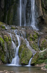 Fototapeta na wymiar Waterfall on a mountain stream