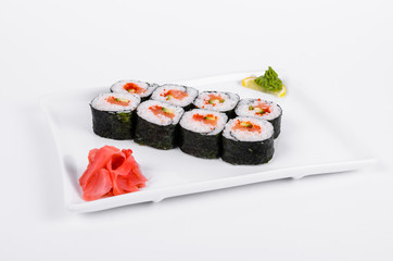 Asia. Rolls with salmon (red fish) on a white plate on a white background