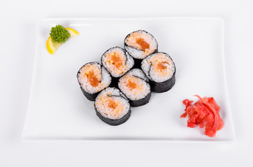 Asia. Spicy rolls with salmon (red fish) on a white plate on a white background