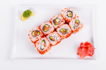 Asia. California rolls with salmon (red fish) on a white plate on a white background