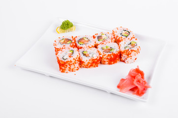 Asia. California rolls with salmon (red fish) on a white plate on a white background