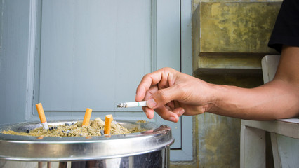 man smoking a cigarette