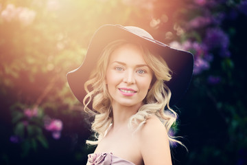 Beautiful Blonde Woman Fashion Model Outdoors. Happy Girl in Hat