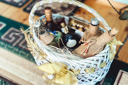 Wine bottles in a basket on a floor