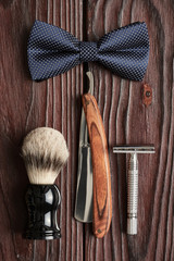 Vintage barber shop tools on wooden background