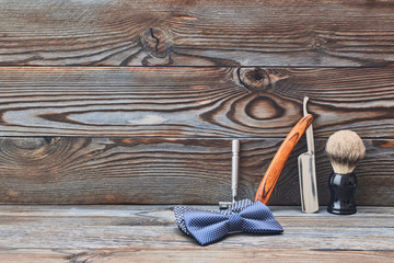 Vintage barber shop tools on wooden background
