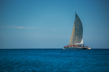 Obraz premium Catamaran with tourists in Carribean sea near Punta Cana