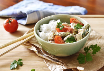 Delicious tofu dish with fresh tomatoes and green asparagus. High angle view. Vegetarian food.