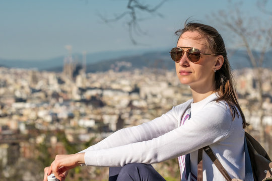 Woman overlooking Barcelona cityscape from Montjuic