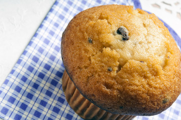a chocolate muffin on romantic decorative naphin 