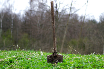 Old shovel stuck in the ground
