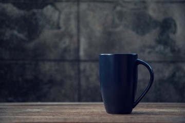 black coffe mug on wood table - Vintage effect style pictures