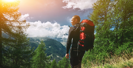 hiker ion the trail n the Apls mountains. Trek near Matterhorn mount