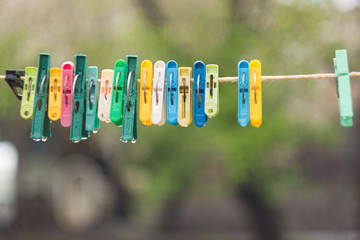 wet colored clothespins on a rope.
