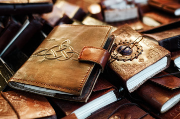 many leather handcrafted diaries and notebook with decorations