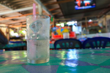 Glass of cold water on table