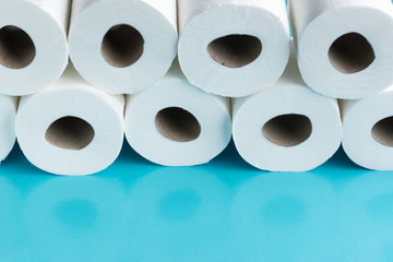Toilet paper rolls in the blue backround.