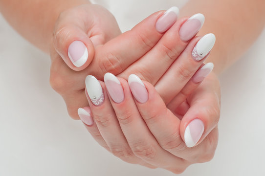 Wedding French manicure with crystals on long oval nails 