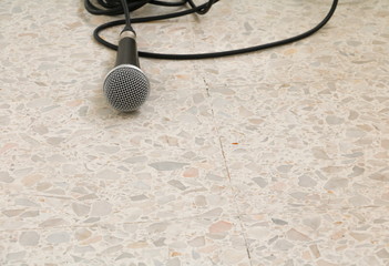 Microphone dynamic on floor marble polished stone background