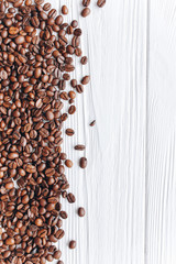 coffee beans on a white wooden background