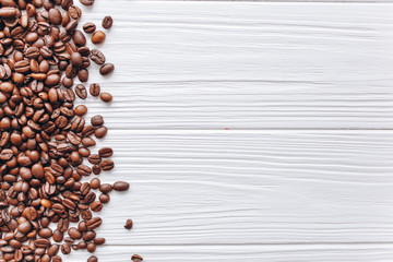 coffee beans on a white wooden background
