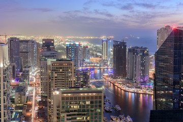 Naklejka premium Scenic view from roof top of Dubai's Jumairah Lakes Towers (JLT) by night