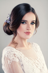 Young Woman Fashion Model with Beautiful Hairstyle and Makeup