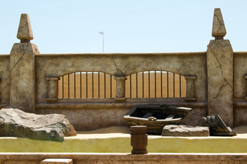 Beautiful fragment of ancient wall with wooden door.