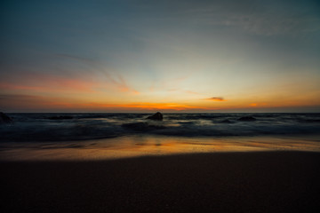 Obraz na płótnie Canvas Colorful sunset over ocean.