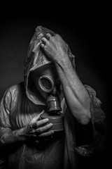 Ebola infection concept, man with red gas mask