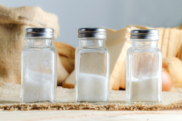 Bottle of salt sugar and wheat flour with bakery ingredient