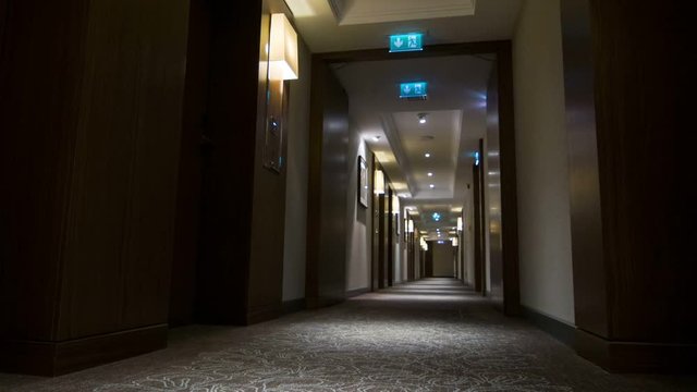 Walking through empty modern hotel hall