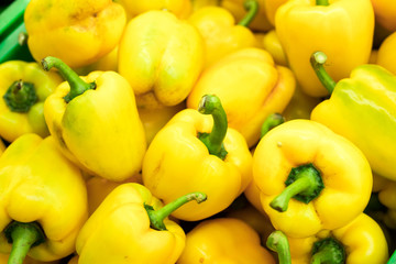 Fresh yellow organic sweet bell peppers on the farmer market on a tropical island Bali, Indonesia. Organic background.