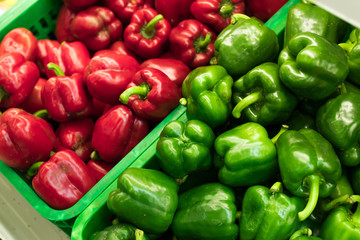 Obraz na płótnie Canvas Fresh red and green organic sweet bell peppers on the farmer market on a tropical island Bali, Indonesia. Organic background.