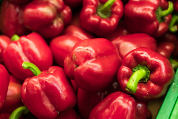 Obraz na płótnie Canvas Fresh red organic sweet bell peppers on the farmer market on a tropical island Bali, Indonesia. Organic background.