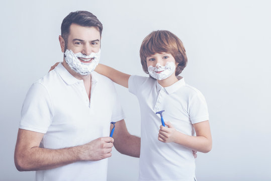 Father Teaching Son How To Shave